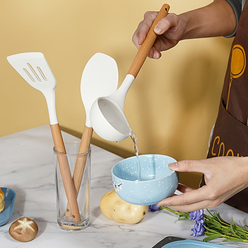 38-piece set of silicone utensils with wooden handles, designed for safe and non-stick cooking. This modern cookware collection is washable and includes all the kitchen essentials and gadgets you need.