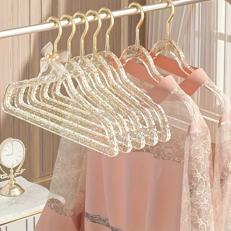 A set of 12 premium acrylic hangers with a non-slip, sparkling transparent design, providing a firm grip for wardrobe storage. These durable, thick hangers are perfect for bedroom closets, offering a traceless hanging solution.