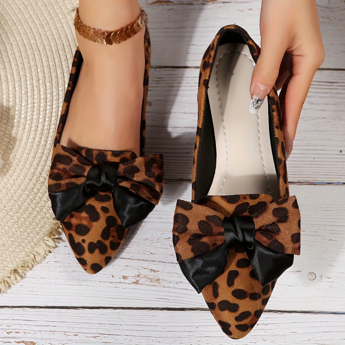 Leopard print flat shoes with bowknot decor and point toe, lightweight slip on style.