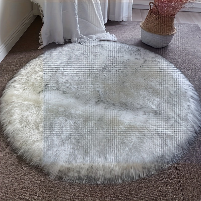 Round luxury area rug made from soft faux fur material with high pile and knit weave, machine washable, lightweight and fluffy. Crafted from a blend of polyester and acrylic in a solid color design. Perfect for adding a cozy touch to bedroom, living