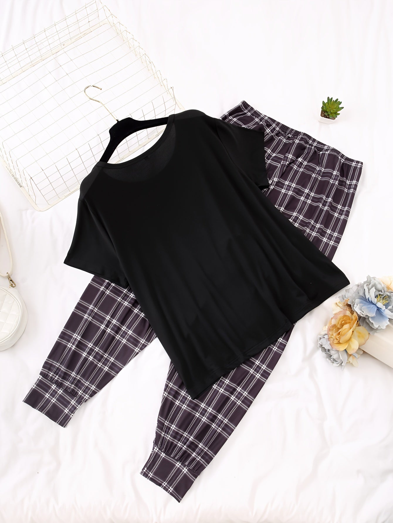 Women's casual pajama set with alphabet pattern, color block design, made of polyester knit fabric with elastane. Includes short sleeve top and long pants loungewear for fall season.