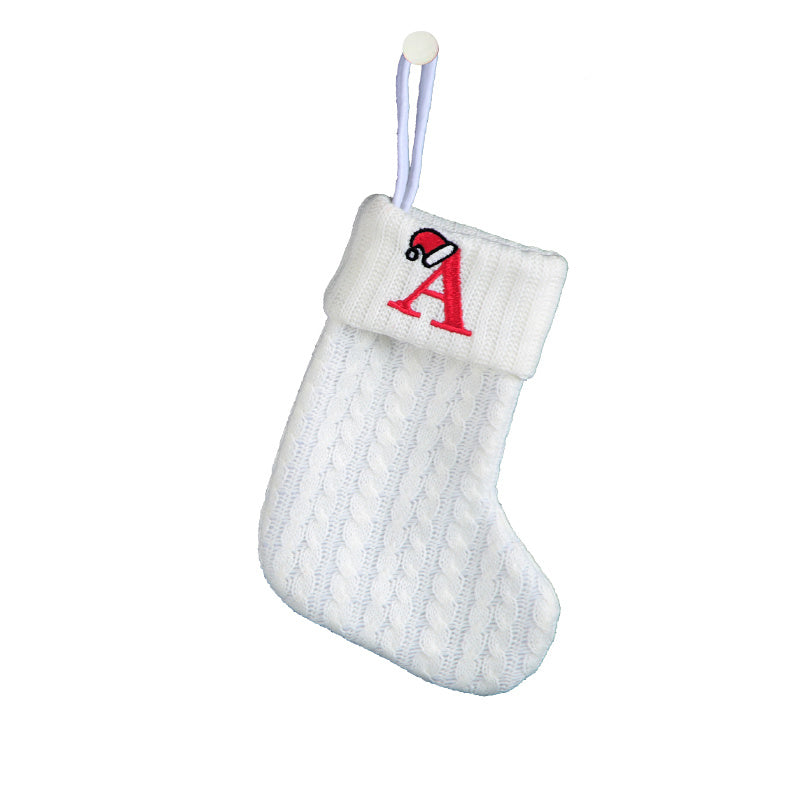 White cable knit stocking with embroidered 'F' - Ideal for indoor decor.