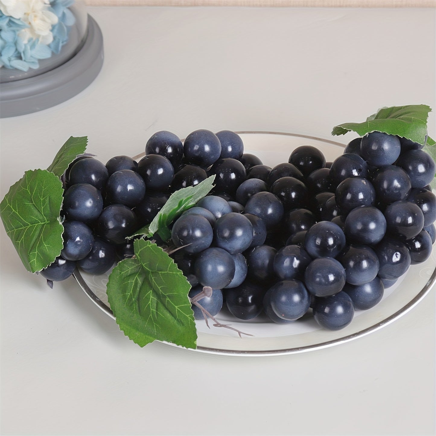 A string of artificial grapes with 36 large beads per string can be hung up for Halloween and Thanksgiving parties, as well as for weddings, kitchen displays, and Christmas gifts.