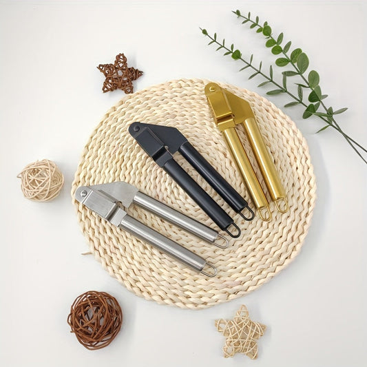 The black and golden Stainless Steel Garlic Press is a Kitchen Manual Garlic Juicer that measures 19.5cm (7.67in) in length. It is designed to be Easy to Clean and Detachable for convenience.