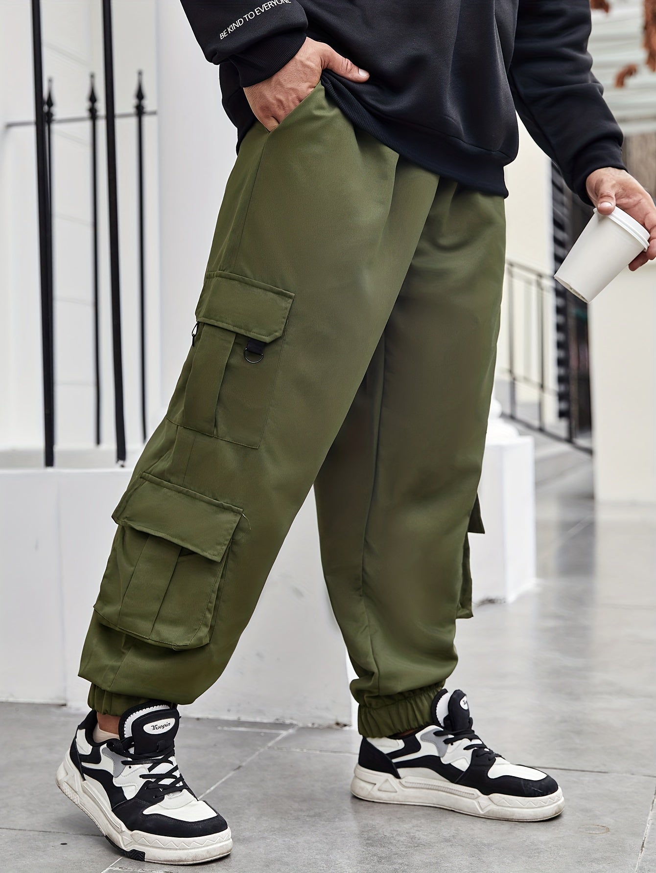 Men's plus size cargo pants with pockets for spring and fall fashion.