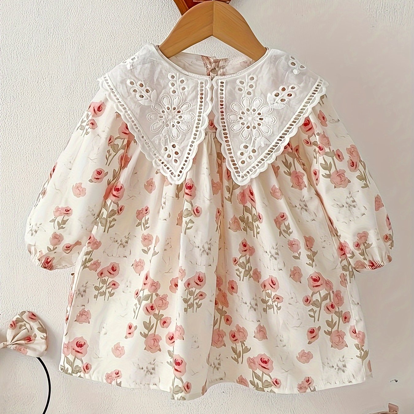 Stylish floral long-sleeve cotton dress with pleated detail, perfect for casual spring and fall wear, machine washable.