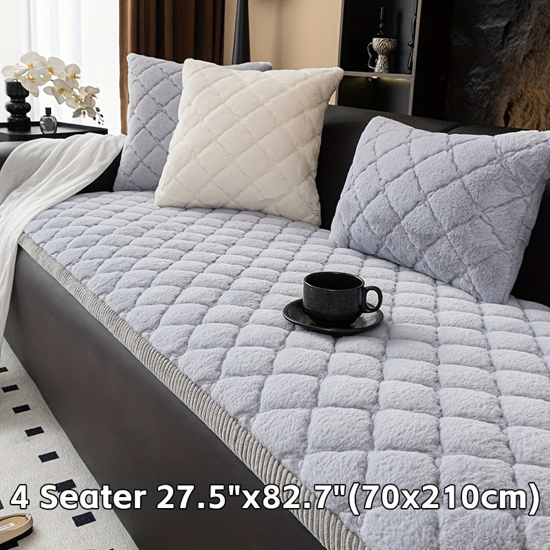 Modern quilted sofa cover, pet-friendly, machine washable, non-slip, thick polyester protector for various furniture sizes and styles in home or office décor.