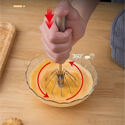 Hand-held stainless steel manual egg beater for baking and cooking, no battery needed.