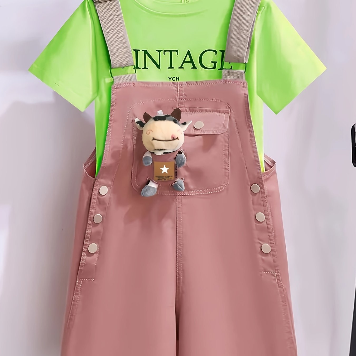 Girls' summer outfit with trendy suspenders and lightweight overalls for outdoor wear.