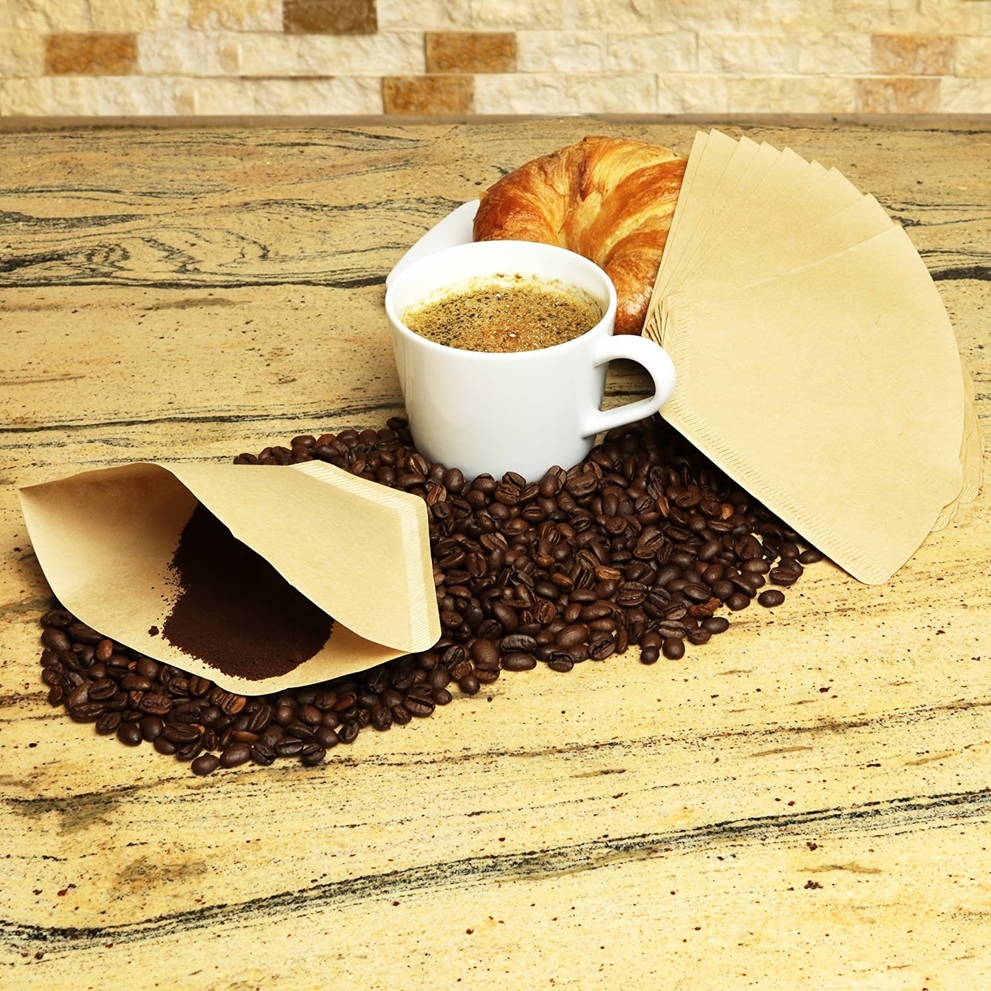 Disposable unbleached natural paper coffee filters for 8-12 cup coffee makers, designed for pour over and drip brewing methods with no blow outs, comes in a pack of 100.