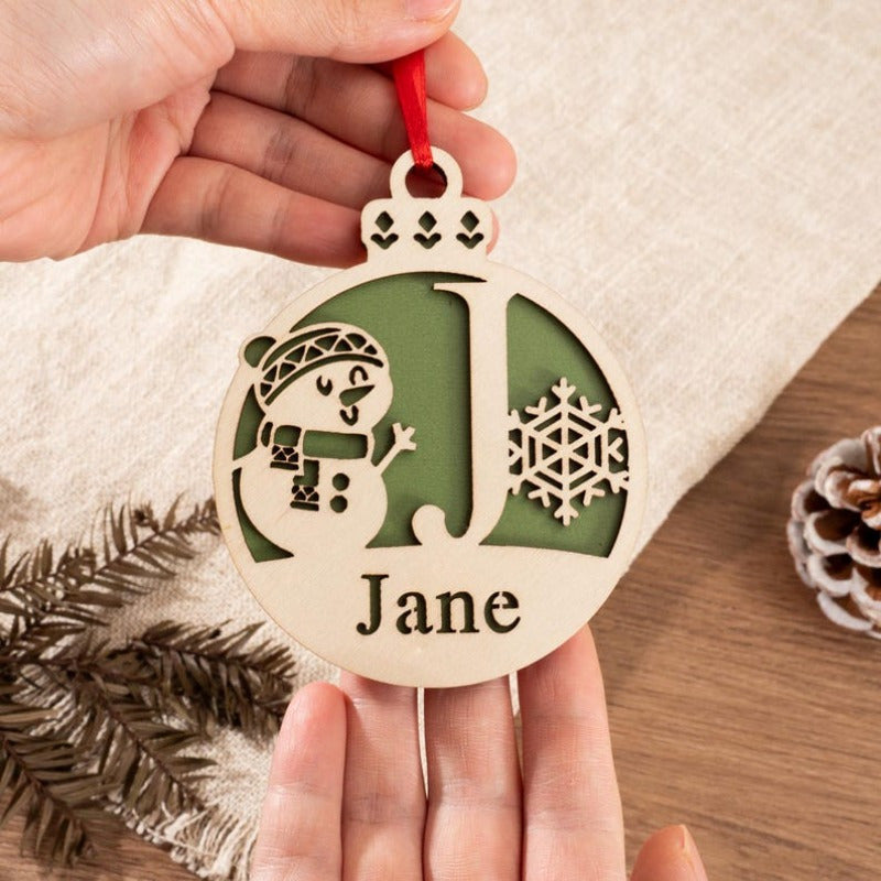 A unique gift for her: a personalized wooden Christmas ornament featuring a festive holiday tree decoration.