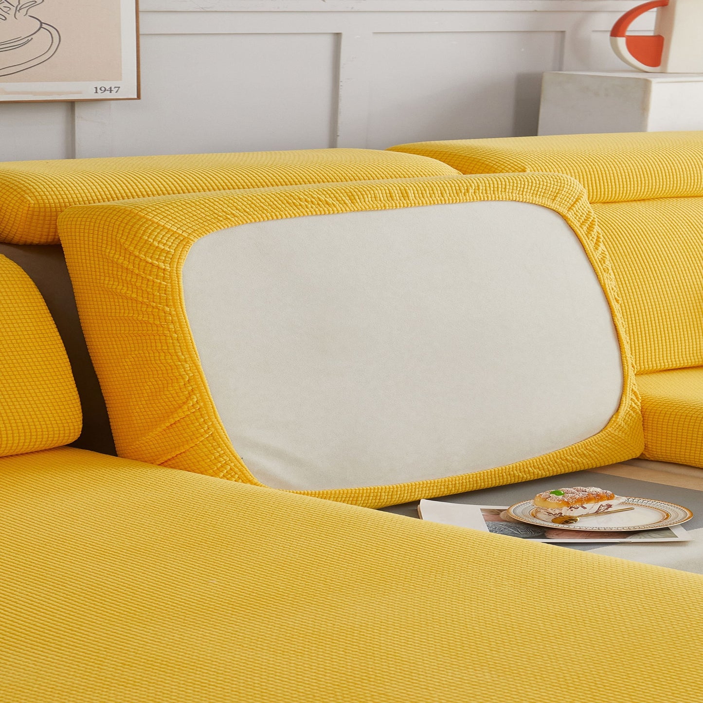 Durable sofa cover protects furniture from spills and stains.