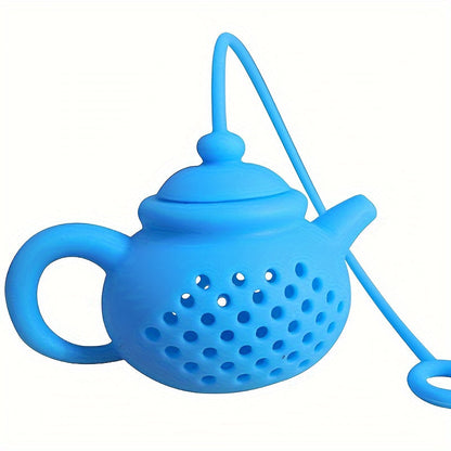 Reusable teapot-shaped tea infuser made of silicone for loose leaf tea, ideal for kitchen and dining use, small in size suitable for making tea.