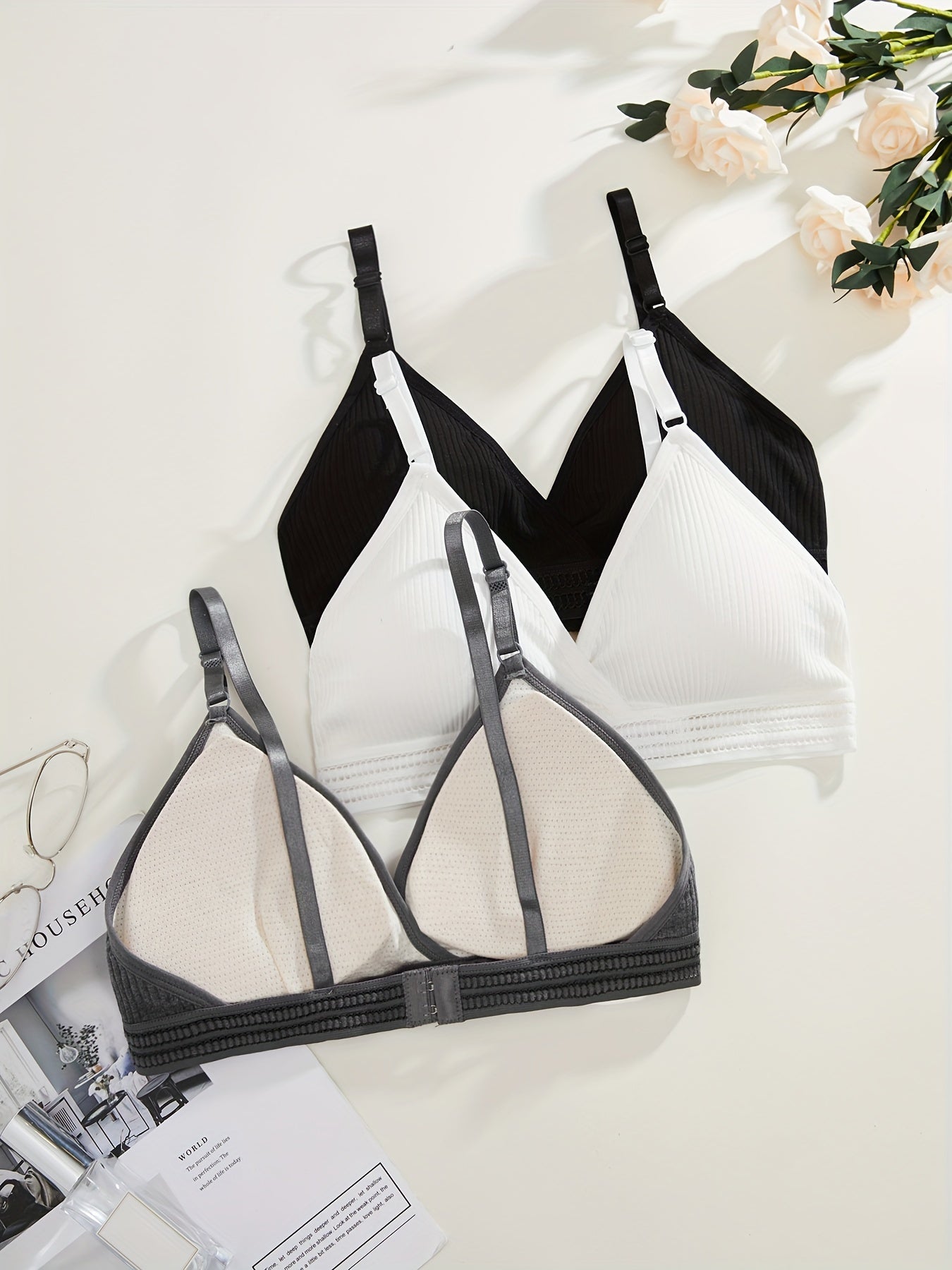 Soft, versatile bra set with removable pads and ribbed texture in black, white, and gray. Perfect for everyday comfort wear.