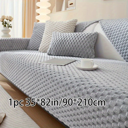 Non-slip sofa cover with honeycomb pattern, ideal for all seasons and protecting furniture in any room.