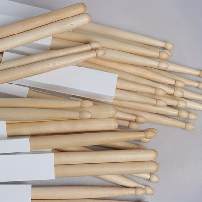 Premium maple drumsticks in 5A and 7A sizes with black logo, suitable for electric drums and practice.