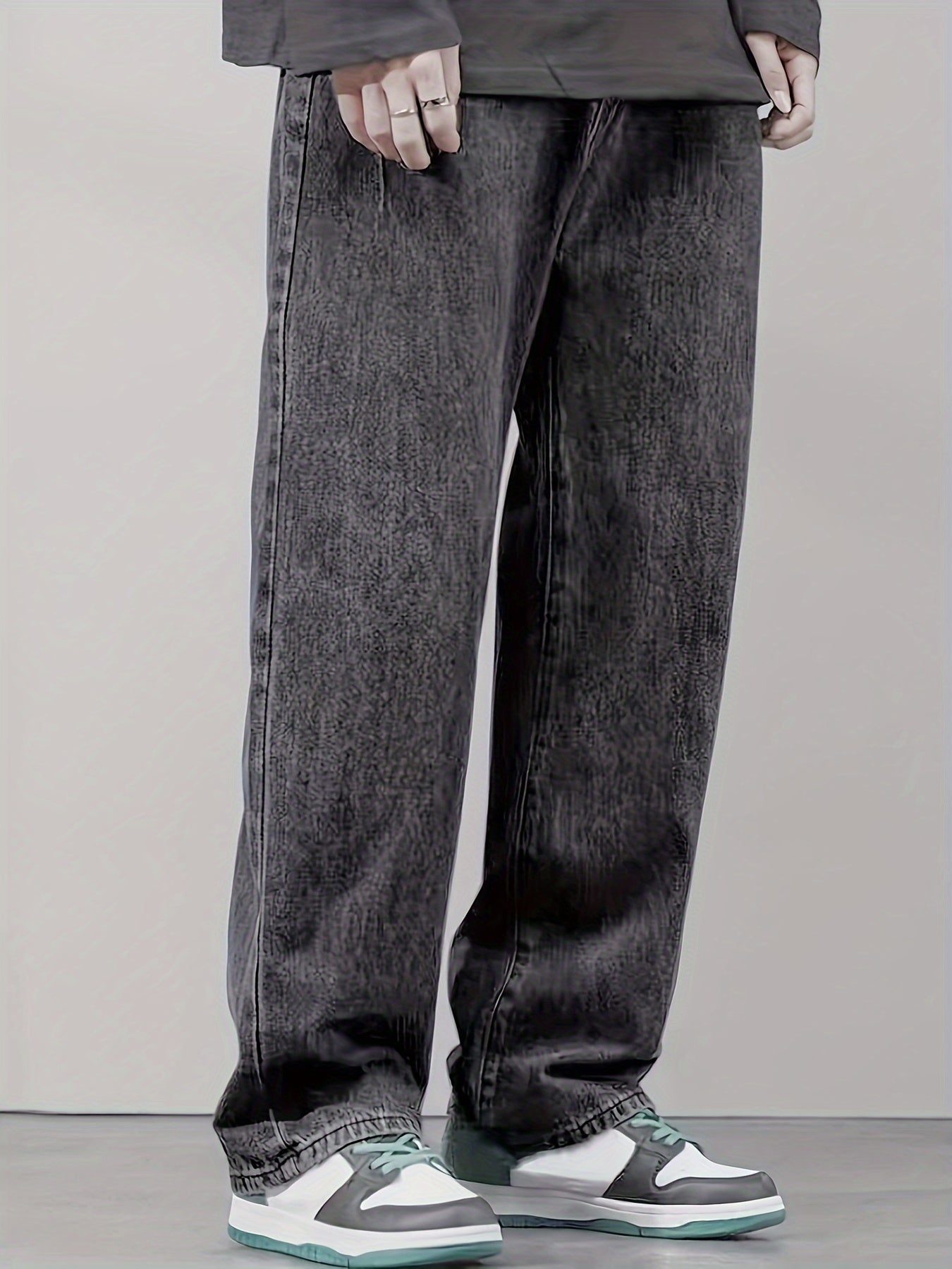 New men's denim long pants suitable for all seasons, featuring a black non-stretch regular loose fit with fold design on both sides of the front, crafted with washed denim for a stylish and