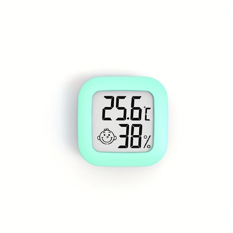 Compact Smart Smile Mini Digital Thermometer with LCD Display provides fast, accurate room temperature and humidity monitoring with included battery. Ideal for indoor use.