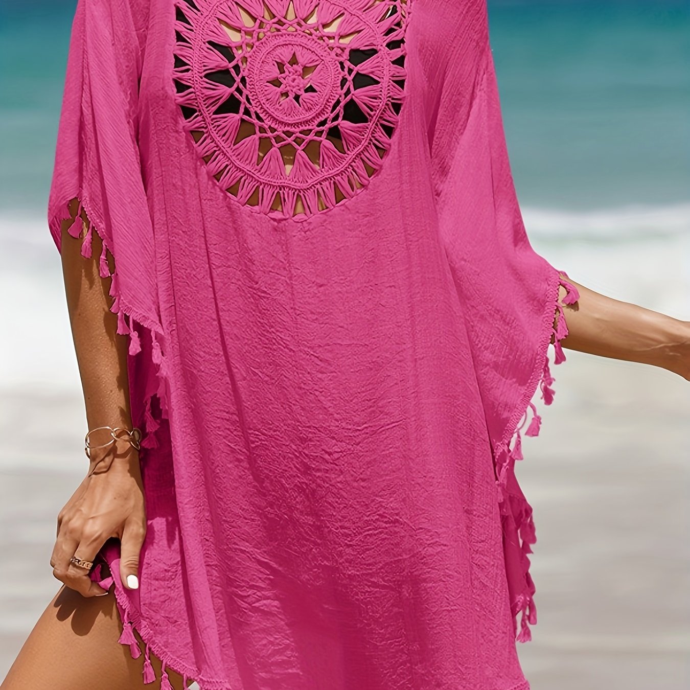 Women's casual beach vacation sunscreen shirt with solid-colored fabric spliced with small tassels for a sexy cover-up style.