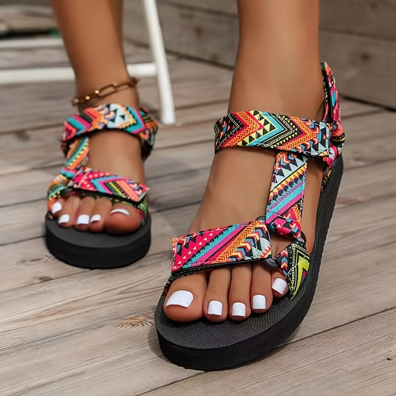 Flat sandals with tribal pattern, open toe and lightweight design for casual summer wear.