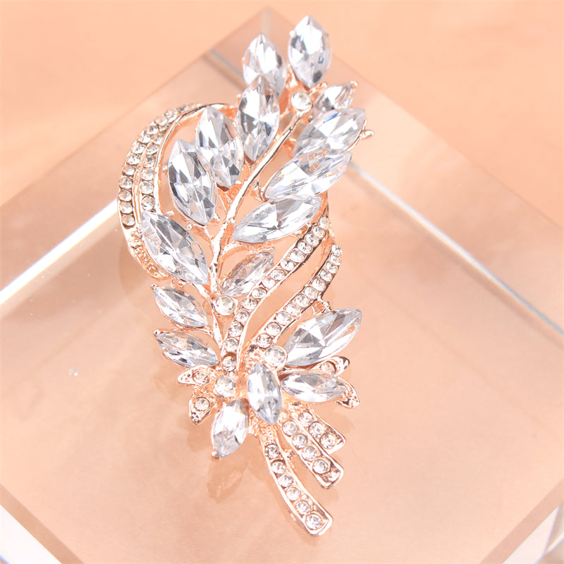 Elegant and luxurious rhinestone flower brooch, featuring an irregular faux floral design. This versatile accessory can be worn on clothing, bags, hats, and as women's fashion jewelry.