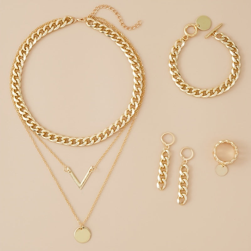 Choose your style with this trendy hip hop jewelry set featuring a 14k gold plated V shape pendant and chain design. The set includes 5 pieces - a necklace, bracelet, earrings, and ring. Available in golden or silvery tones, make your call now.