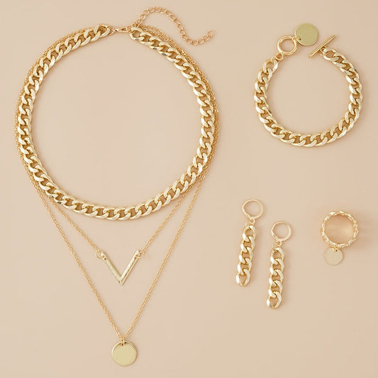 Choose your style with this trendy hip hop jewelry set featuring a 14k gold plated V shape pendant and chain design. The set includes 5 pieces - a necklace, bracelet, earrings, and ring. Available in golden or silvery tones, make your call now.