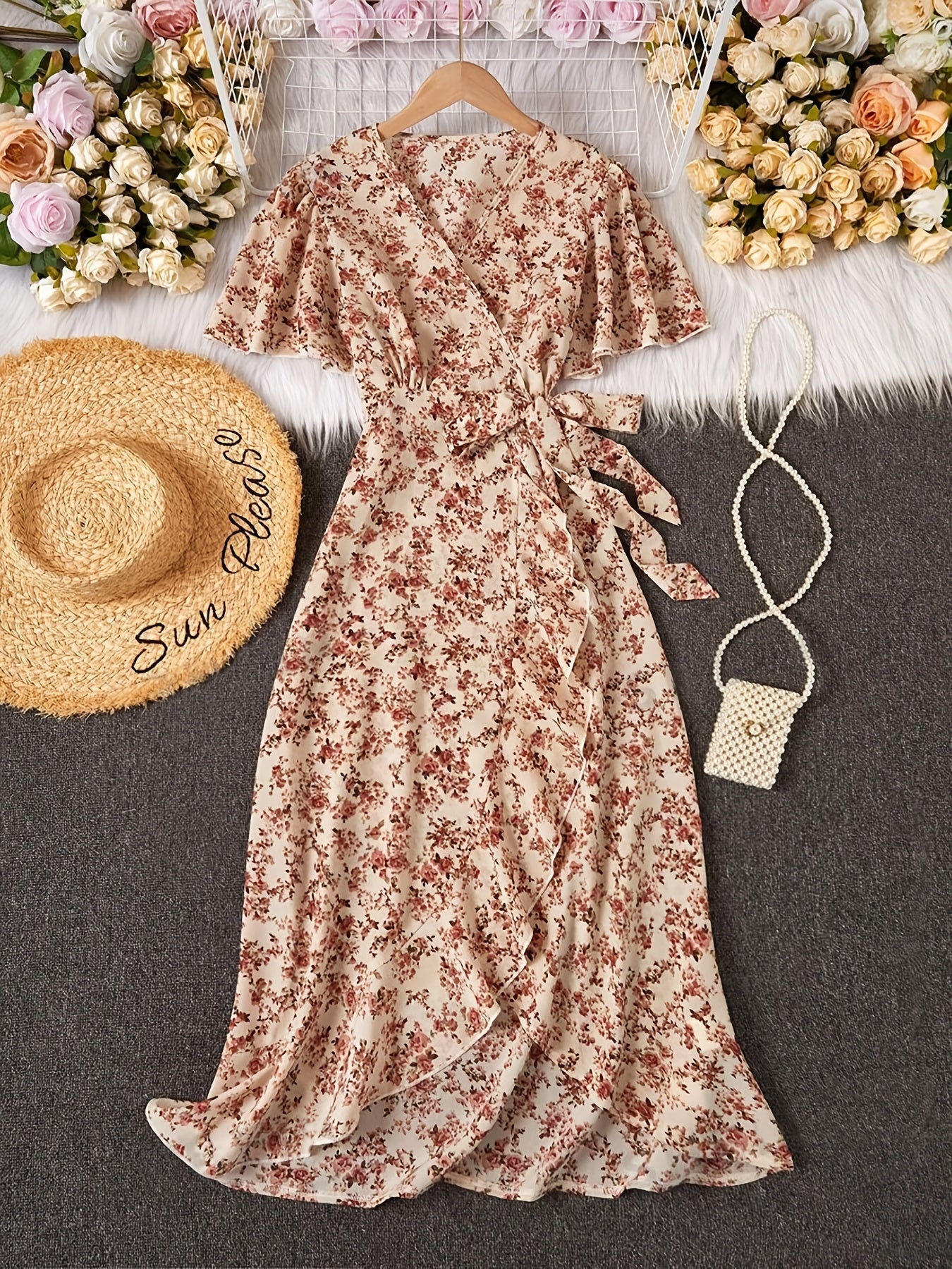 Women's elegant floral dress with bohemian ruffle sleeves, criss cross neckline, and lace-up detail. Made with woven polyester fabric, regular fit, includes belt. Suitable for all seasons.