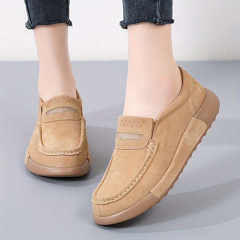 Women's slip-on loafers in solid color with round toe, casual low-top design.