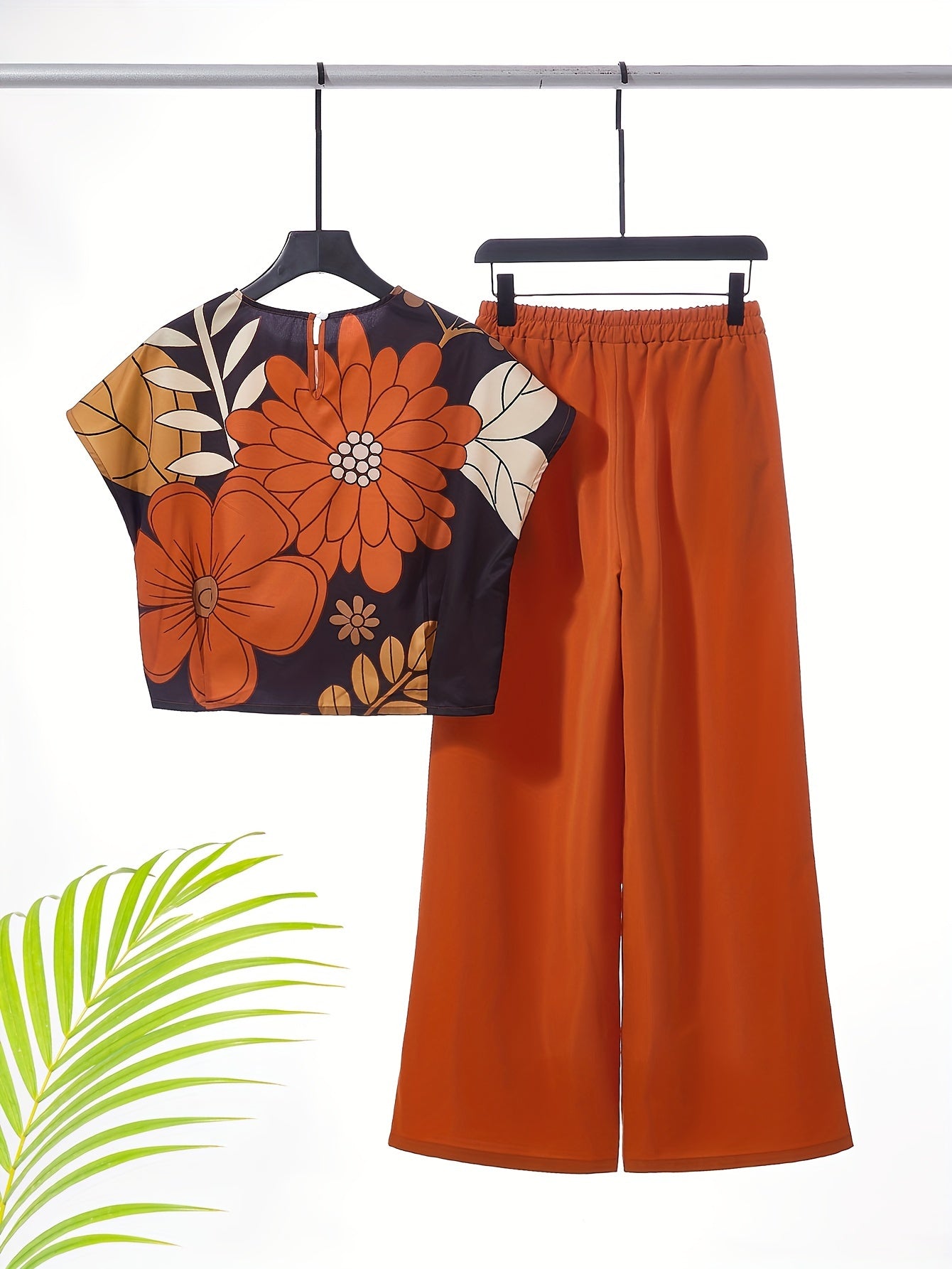 Women's two-piece set featuring a crew neck top and wide-leg pants, machine washable, part of the Spring/Summer Collection.