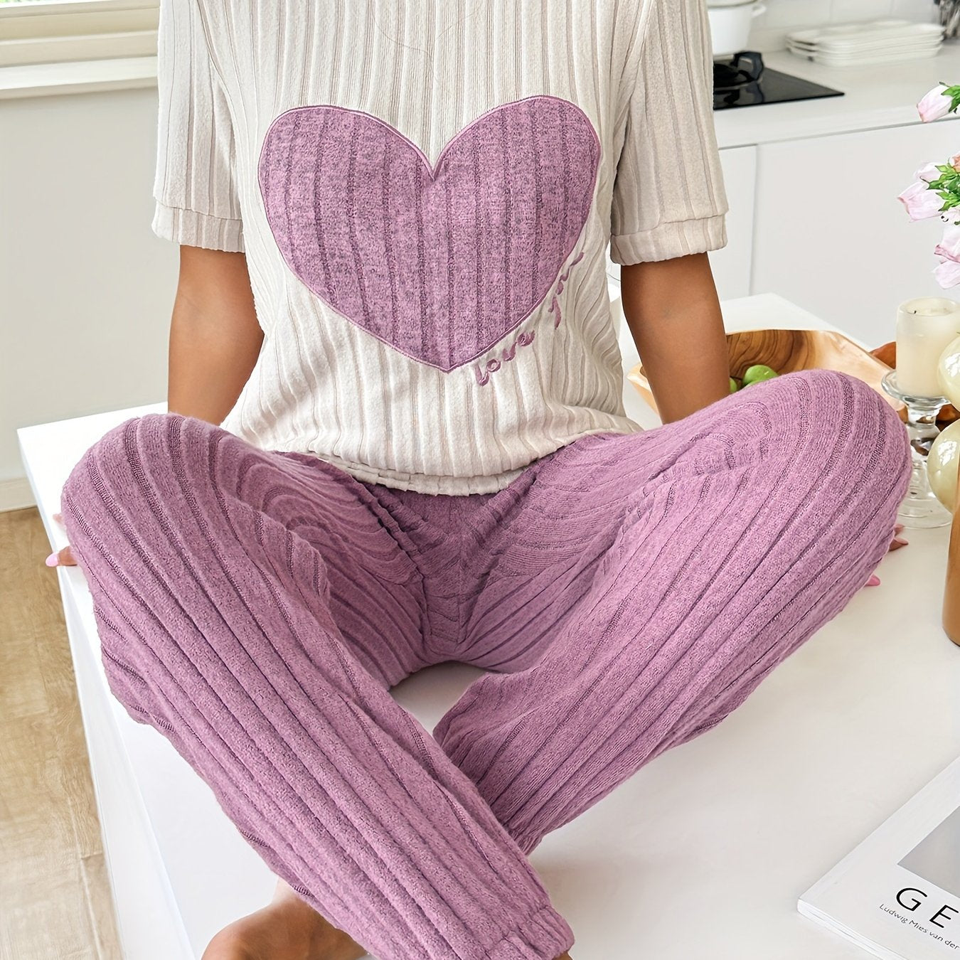 Women's heart and letter print pajama set with short sleeve top and joggers, relaxed fit for comfortable summer nightwear.