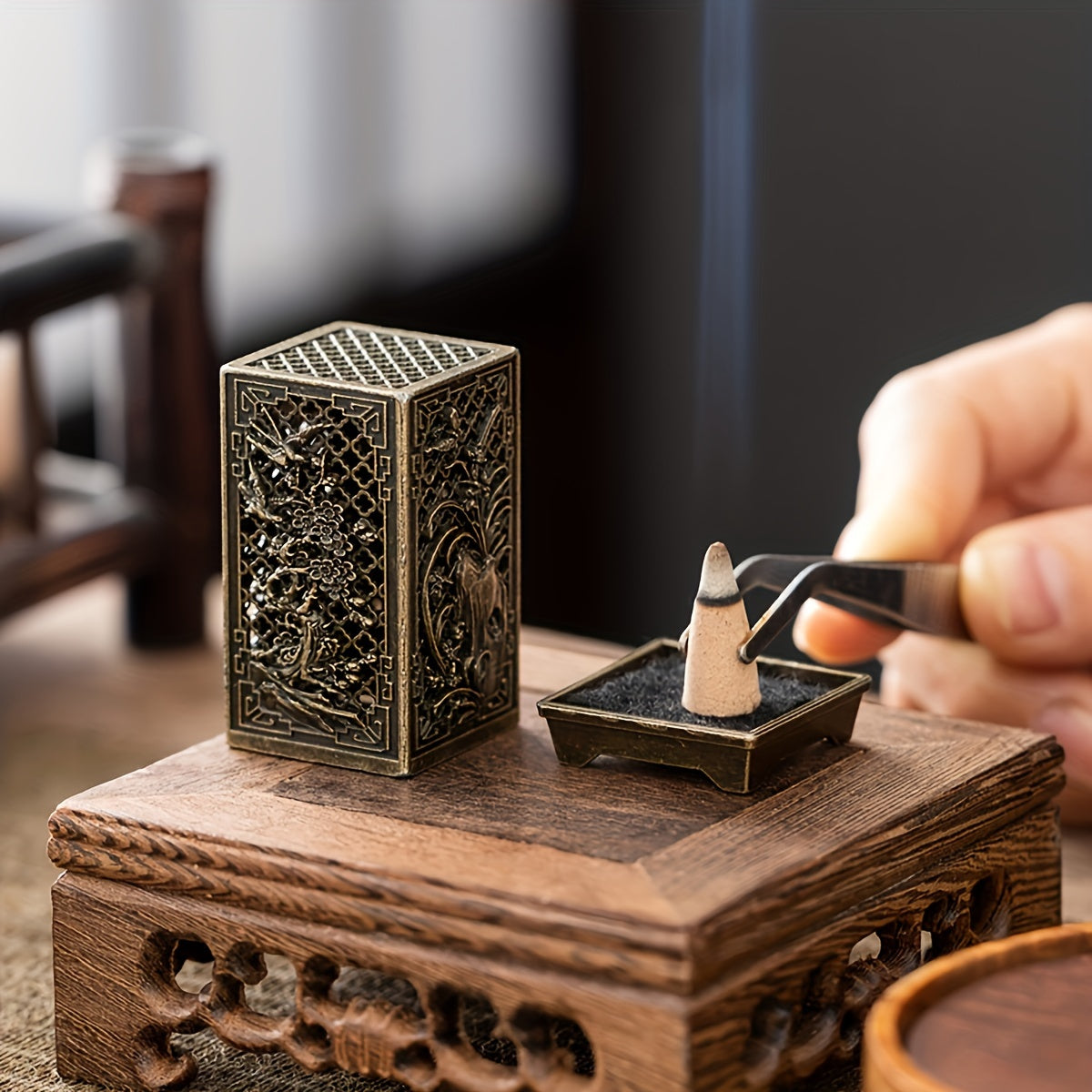 Stylish incense burner with bamboo and plum blossom design in copper/gold finish for home or office décor.