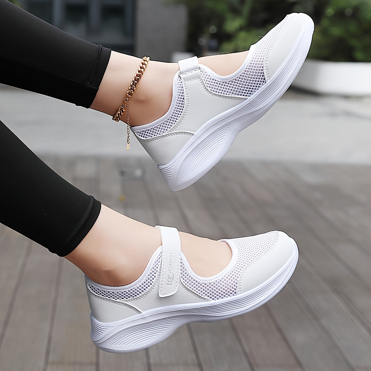 Comfortable slip-on sneakers for women with breathable mesh, supportive arch compression, lightweight non-slip sole, in white.