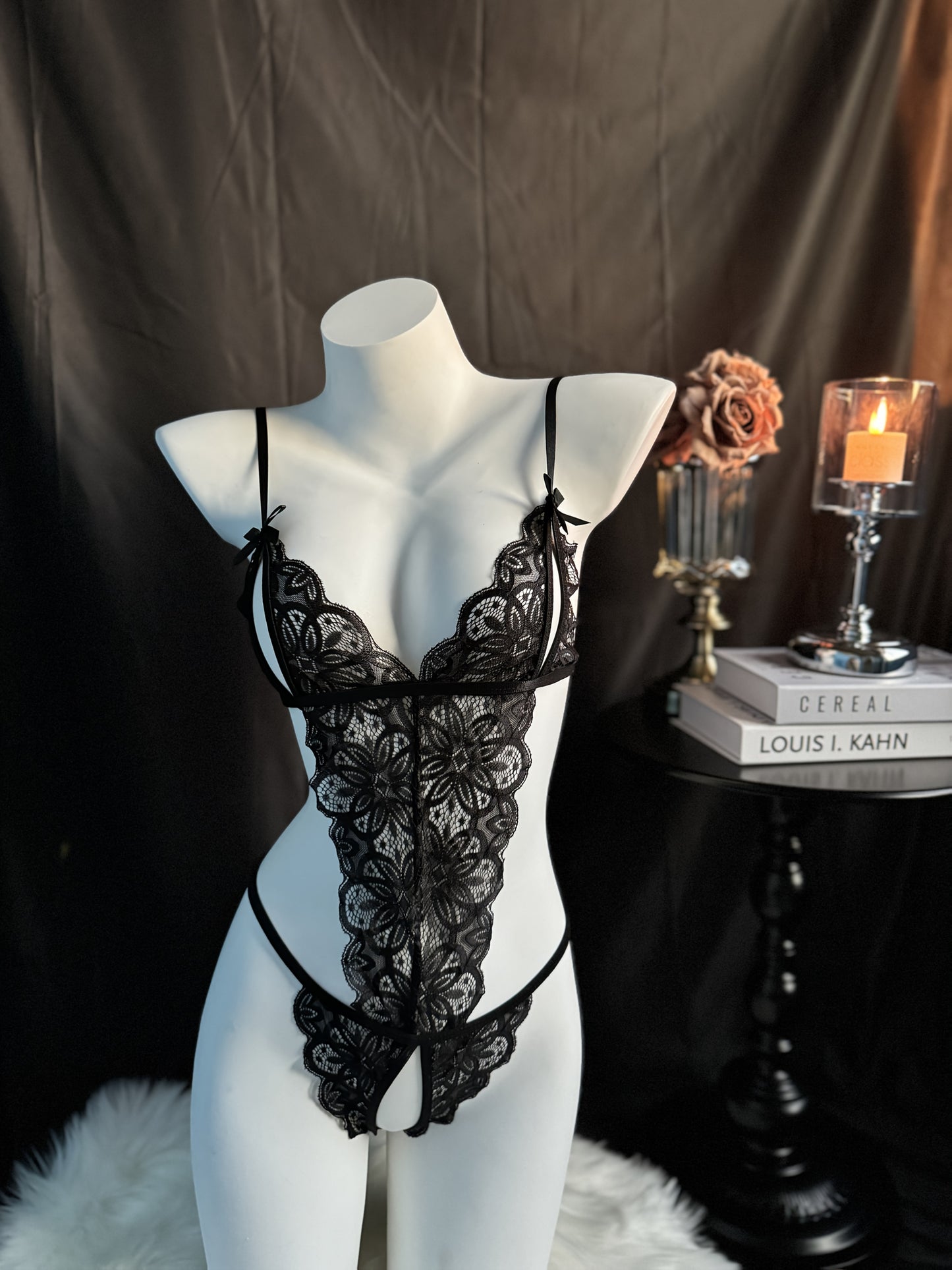 Sexy lace bodysuit for women with bow detail, metal back clasp, light support. Polyester 95%, spandex 5%. Adult sleepwear.