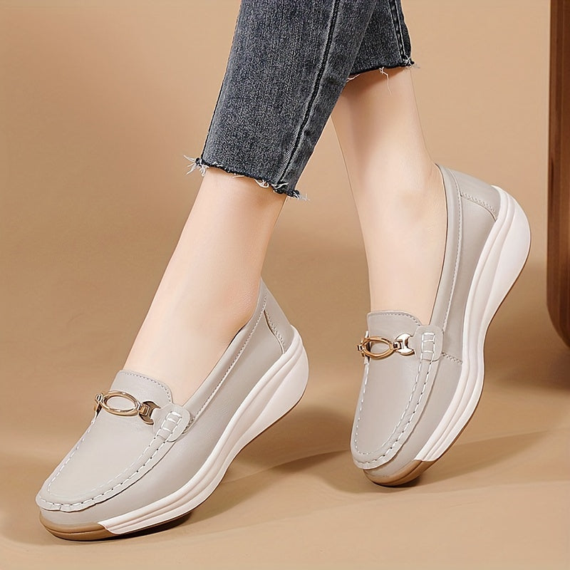 Versatile beige slip-on loafers for women with thick, non-slip soles and decorative buckle detail. Comfortable and lightweight for all-season wear.