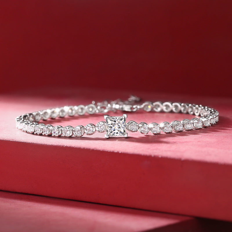 Sparkling with pure elegance, this 925 sterling silver Moissanite tennis bracelet features a dazzling display of shiny round-cut Moissanite stones, making it the perfect accessory for weddings, banquets, and special occasions. Give it as an anniversary