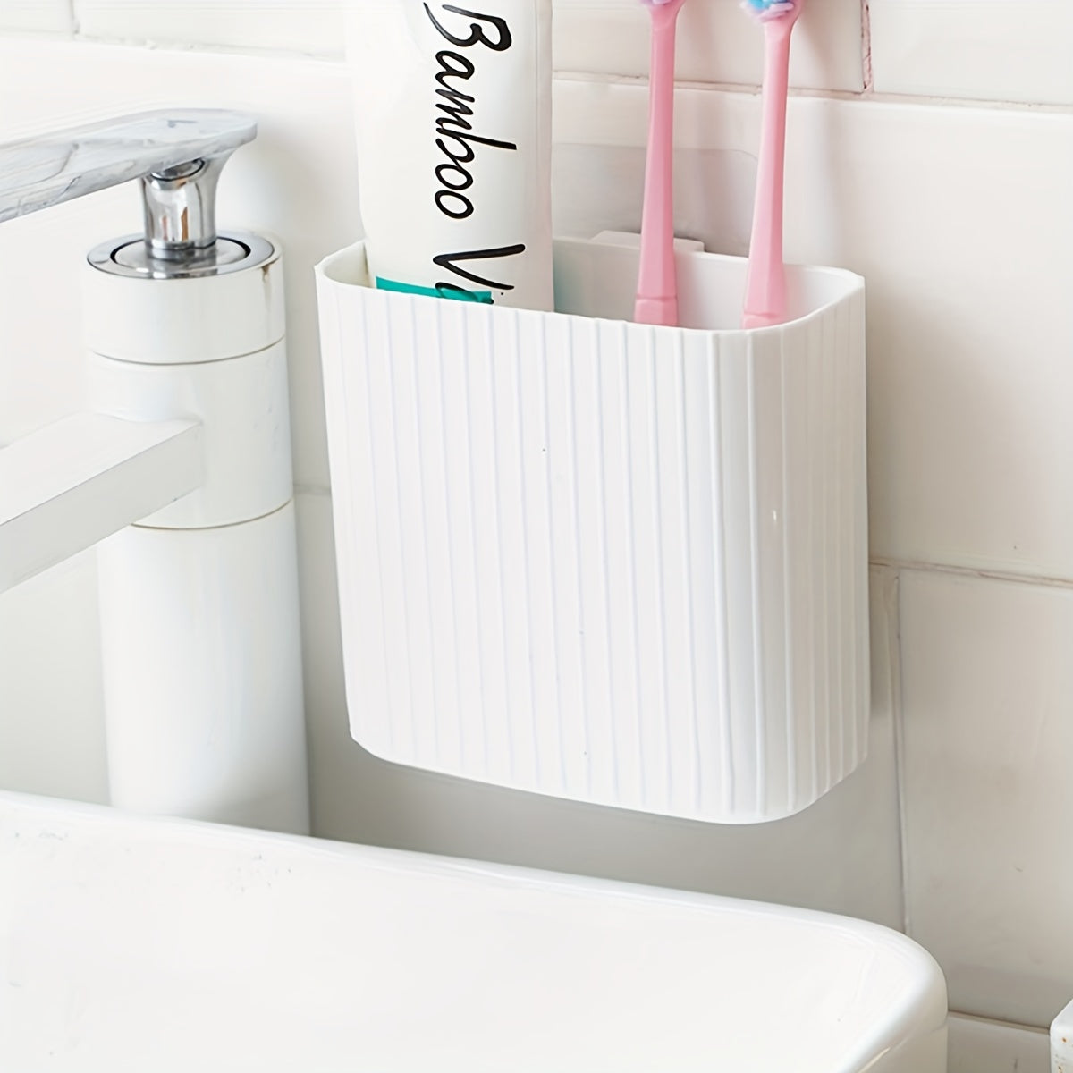 Wall-mounted toothbrush storage box for organizing toiletries, suitable for kitchen, bedroom, bathroom, office, and desk.