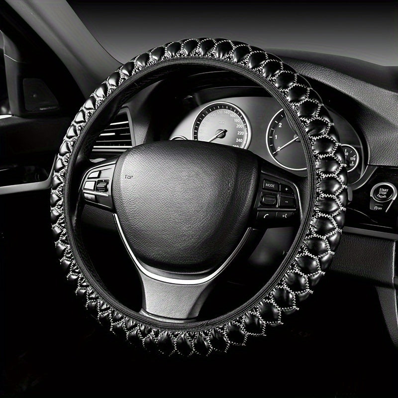 Luxurious embroidered faux leather steering wheel covers with anti-slip grip, universal fit. Comfortable and durable accessory for your vehicle.