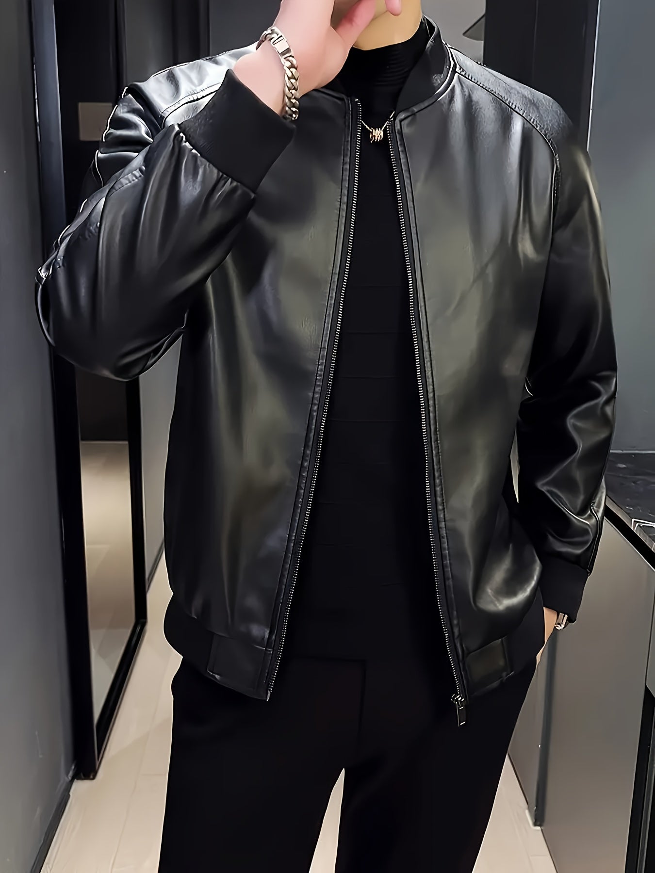 Stylish men's black PU leather jacket with casual baseball collar, zip-up pockets, loose fit, and machine washable - perfect for casual attire.