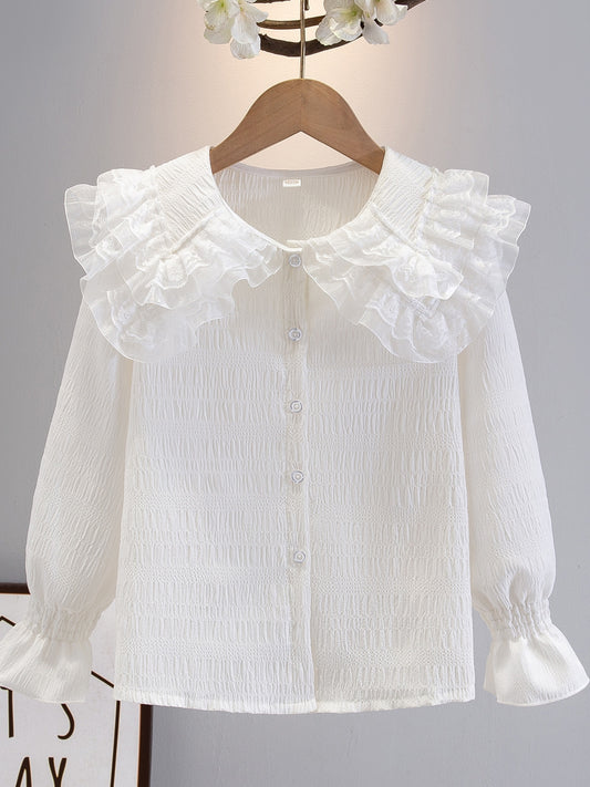 Girls' long-sleeve chiffon shirt with ruffled collar in solid color, perfect for a sweet academic style in spring/fall. Made of polyester, ideal for casual wear.