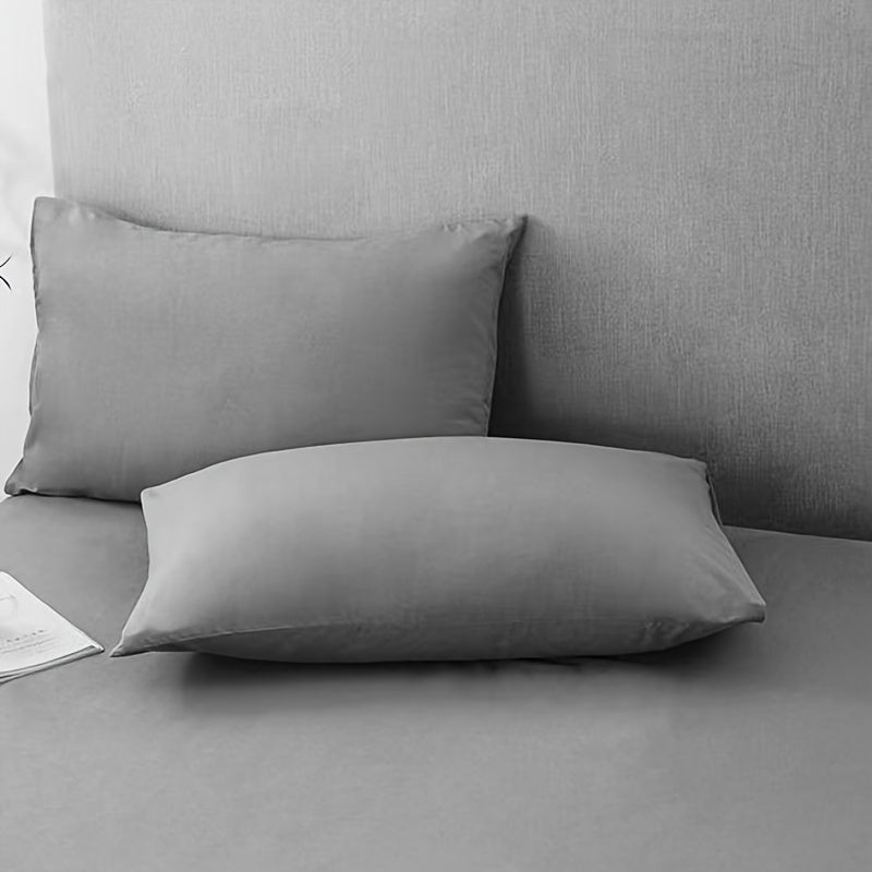 Choose from three different colors - Pure White, Gray, or Navy Blue, with this set of two solid color versatile pillowcases. Made from soft and breathable material with a frosted treatment, these pillowcases are machine washable and come without any