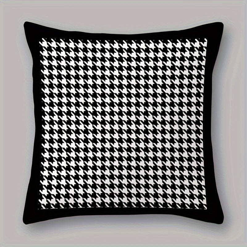 This reversible Contemporary Houndstooth Throw Pillow Cover measures 44.96cm and features a zipper closure. Made of woven polyester, this machine washable cushion case is perfect for living room decor. The black and white design adds a modern touch and