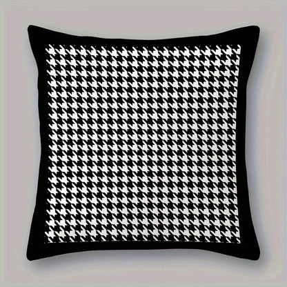 This reversible Contemporary Houndstooth Throw Pillow Cover measures 44.96cm and features a zipper closure. Made of woven polyester, this machine washable cushion case is perfect for living room decor. The black and white design adds a modern touch and