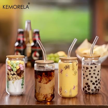 Kemorela 6-piece set includes glass cups with bamboo lids and straws in beer can shape, perfect for various beverages. Also includes 2 cleaning brushes.