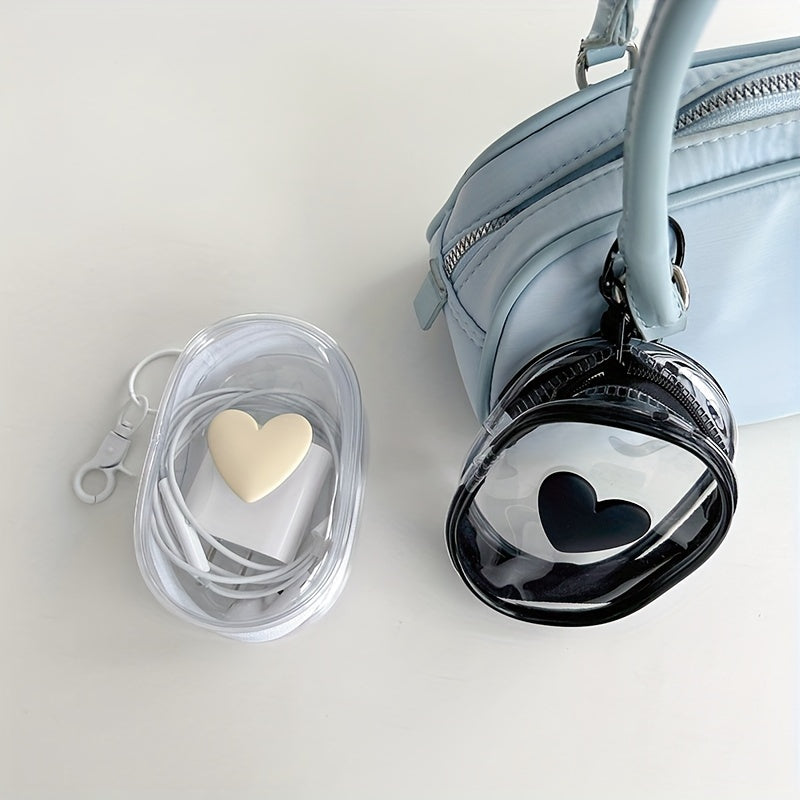 Waterproof heart-shaped PVC bag with keychain for organizing cables and headphones.