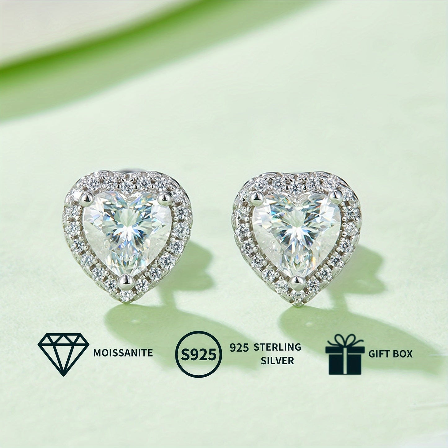 A set of elegant women's jewelry includes a pair of heart-shaped s925 silver earrings featuring 0.5ct*2 moissanite stones, a 1.0ct moissanite pendant necklace, and a matching necklace chain. The set weighs 2.88g for the necklace and 1.58g for the