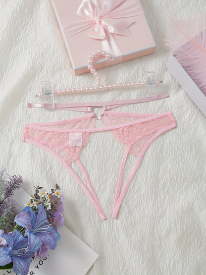 Stylish pink lace thongs for women, featuring a low-rise design with cut-out metal ring detail. Made from a breathable nylon/elastane blend for comfort during intimate moments.