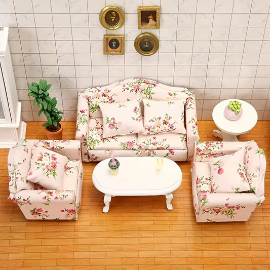 Miniature dollhouse furniture, a single sofa with a pink and green floral pattern and a matching pillow, perfect for a 1:12 scale dollhouse.