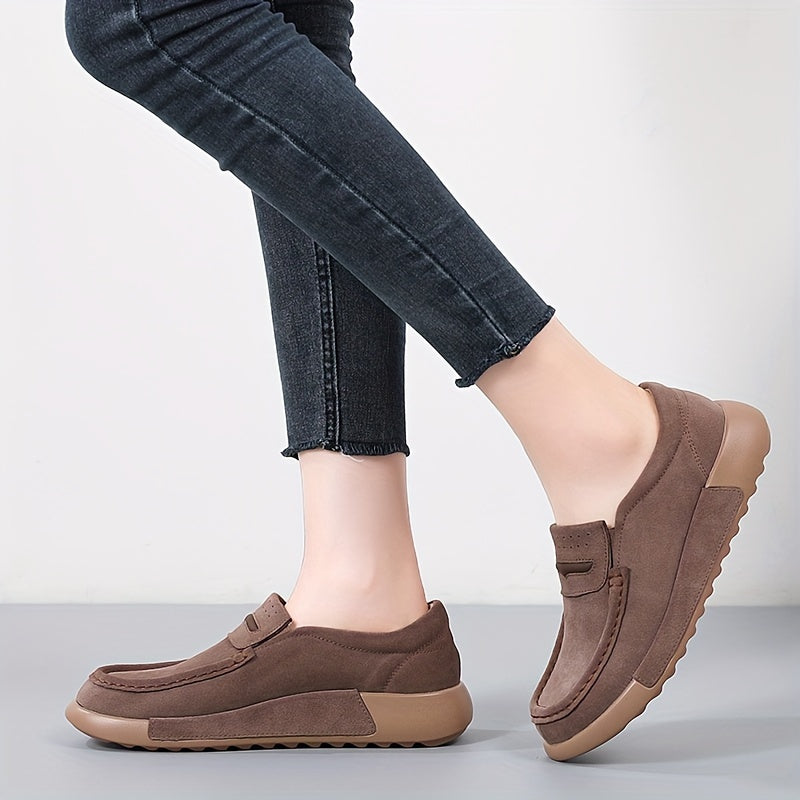 Women's slip-on loafers in solid color with round toe, casual low-top design.