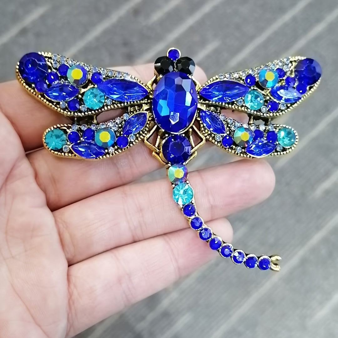 Dragonfly-shaped brooch with a retro design, adorned with sparkling rhinestones. Perfect for adding a touch of elegance to women's dresses, coats, sweaters, or corsages.